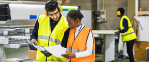 Quality manager reviewing the correct document revision at a manufacturing workstation using Doc-Trak