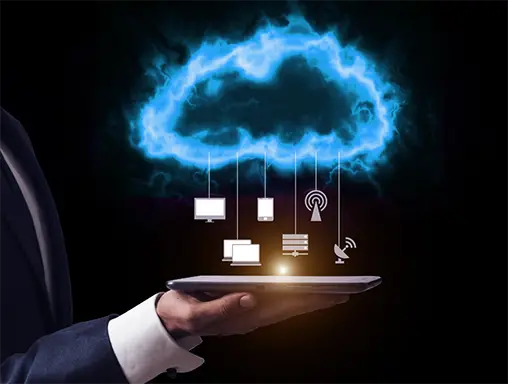 conceptual image of a blue cloud raining business icons onto a tablet screen